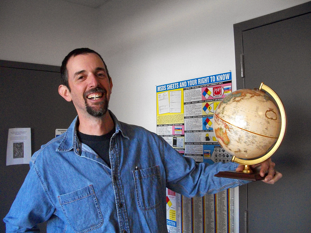 Man holds globe