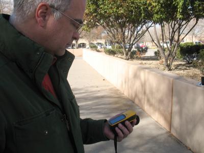 Man holding GPS unit
