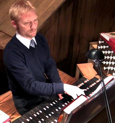 Man playing an organ