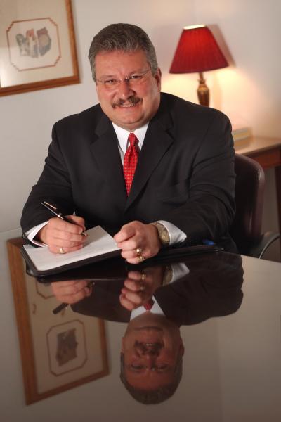 Man sitting at table with red tie