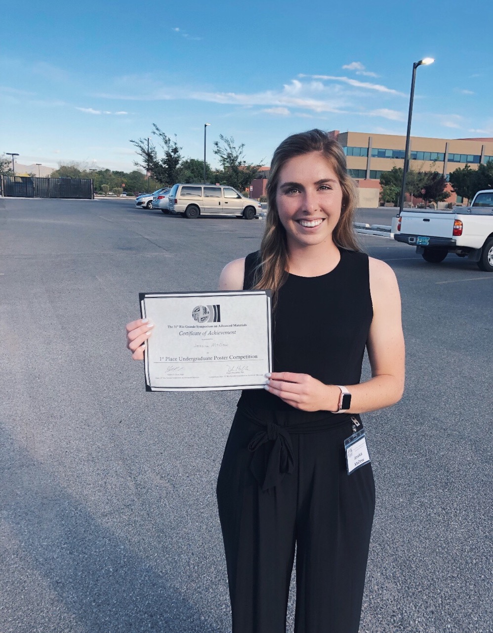 Woman holds certificate 