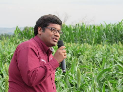 Man with mic in field