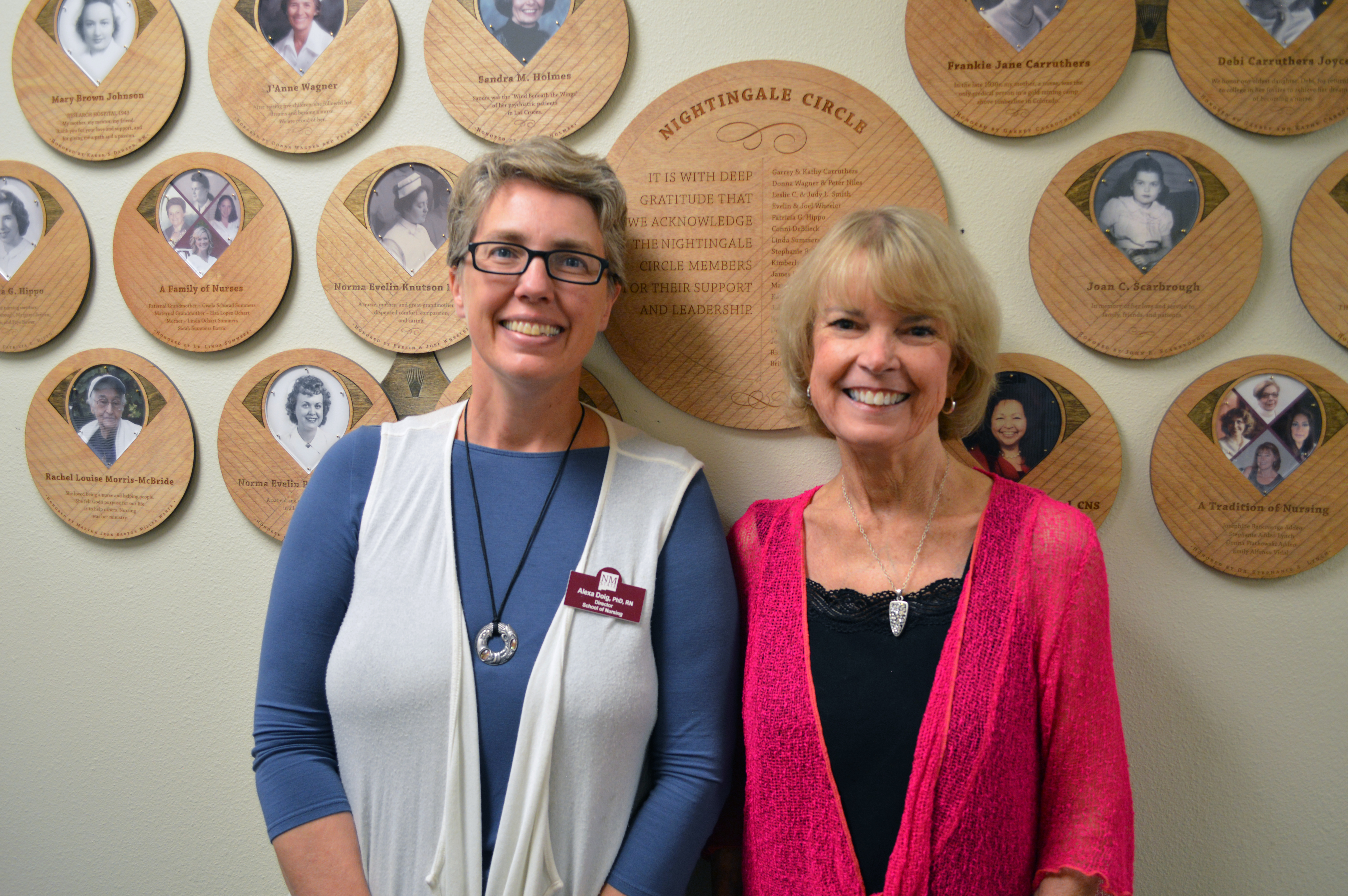 Karen Hand, a retired nursing professor who mentored and inspired hundreds of students during her 28-year career in the College of Health and Social Services at New Mexico State University, is the latest addition to the college’s Nursing Wall of Excellence.  Two women stand side-by-side. Karen Hand, a former nursing professor at New Mexico State University, right, stands next to Alexa Doig, the director of the School of Nursing, after the unveiling of Hand’s plaque on the Nursing Wall of Excellence in honor of her 45-year career and commitment to the nursing profession. (Courtesy photo) Hand, who has a Ph.D., joins a group of esteemed nurses who grace the Nursing Wall of Excellence in honor of their legacies and commitments to the nursing profession.   Hand has 45 years of nursing experience and comes from a family of health care professionals: her paternal grandfather and his four brothers were physicians; her mother and grandmother were nurses; her three brothers were medical professionals; and her four daughters started careers as a doctor, dentist, veterinarian and an ICU nurse.  “Nursing is the perfect combination of the humanities and sciences,” said Hand, who has bachelor’s and master’s degrees in nursing as well as a Ph.D. in nursing science. “I think it’s a privilege to care for people when they’re ill, dying or at life’s beginning.”  NMSU’s School of Nursing unveiled the Nursing Wall of Excellence in 2014. Based at the entrance to the Health and Social Services Building on the main campus, the wall features an audio and visual history of the School of Nursing, as well as a special collection of plaques with names and photos of honored nurses. Funds used to add a nurse to the wall support scholarships for NMSU nursing students.   “We are always pleased to honor our retired faculty members with the special recognition of a plaque on the Nursing Donor Wall. Involving one of our donors in this process makes it all the more meaningful,” said Tina Byford, interim vice president of University Advancement.   In her professional career, Hand served as an intensive care nurse, cardiovascular nurse specialist, health care administrator and nursing professor at NMSU. She also served for many years on the New Mexico Board of Nursing’s Education Advisory Committee and the National Council of State Boards of Nursing.  Hand came to NMSU in 1985 to serve as a clinical instructor in the School of Nursing. She retired from the university in 2017 after having taught hundreds of nursing students. Two years before her retirement, she earned a Ph.D. in nursing science from NMSU.  “The NMSU School of Nursing has such a long history of excellence. NMSU is known as an excellent university, and the School of Nursing, especially, is known to be excellent,” she said. “We know that because the hospitals in our community and other partners in the community will tell us that our graduates are very well prepared to begin their nursing careers.”  While teaching at NMSU, Hand most enjoyed supervising nursing students at hospitals and overseeing their approach to patient care, she said.  “When you take students into the hospital that seems to be where nursing knowledge is really integrated,” she said. “It synthesizes everything they’ve learned about the sciences and humanities. And, when it comes together and they see a disease a in their patient, they never forget it.”  Hand’s appointment to the Nursing Wall of Excellence came as a surprise to her. Over the summer, she learned that an anonymous person from the College of Health and Social Services had donated funds on her behalf to add her name and picture to the wall. She attended the plaque-hanging ceremony in August.  “I’m honored and I’m so humbled,” she said.  For more information, or to purchase a plaque, contact the CHSS Development Office at 575-646-5061.