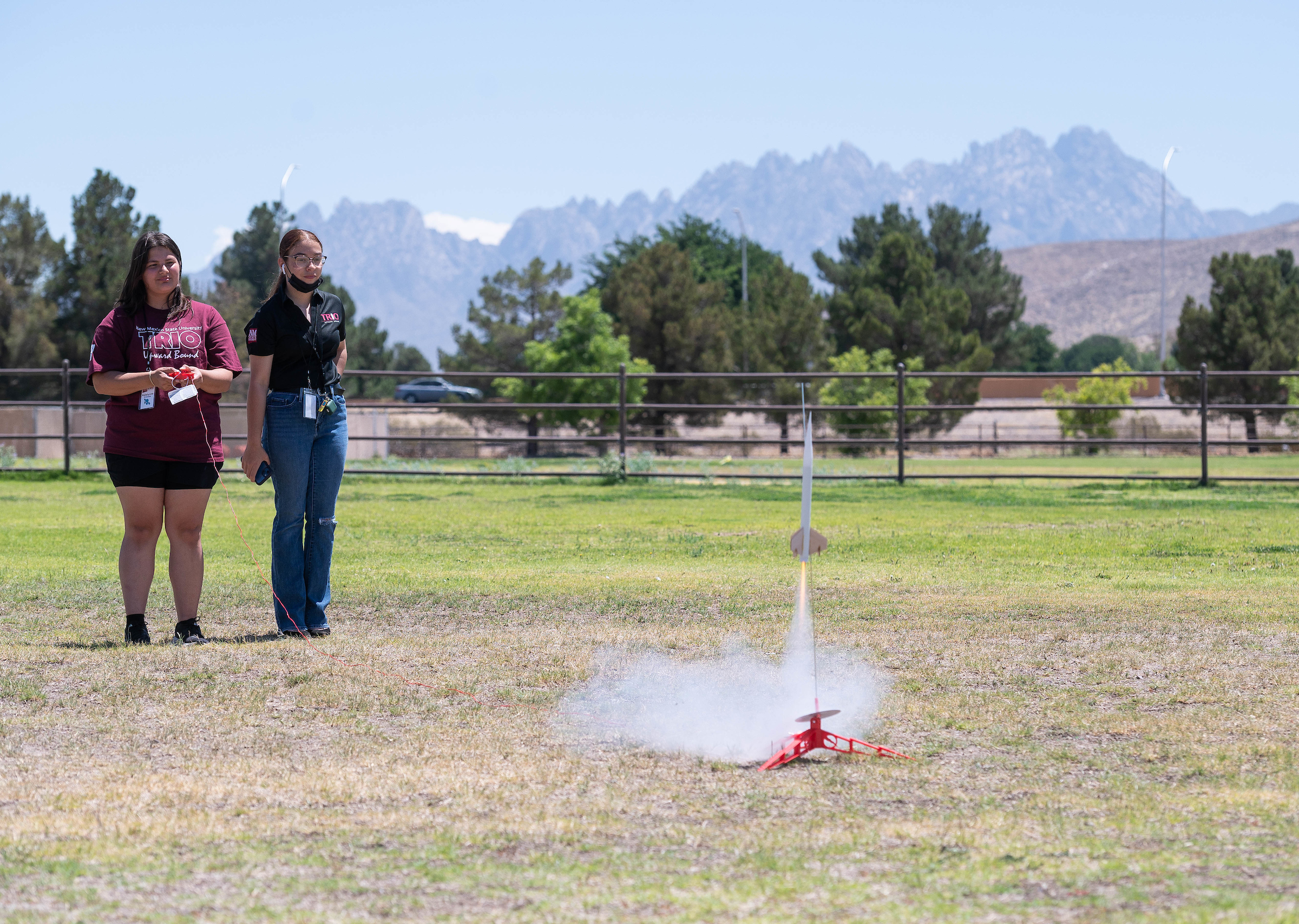 Aggie Academy Mini College program participants, Katelynne Britosalas, left, and Laila Barreras, launched rockets on the New Mexico State University Las Cruces campus as part of the 2022 Crimson Summer Institute for the TRIO Upward Bound Gadsden Independent School District/Las Cruces Public Schools Program. (NMSU photo by Josh Bachman)