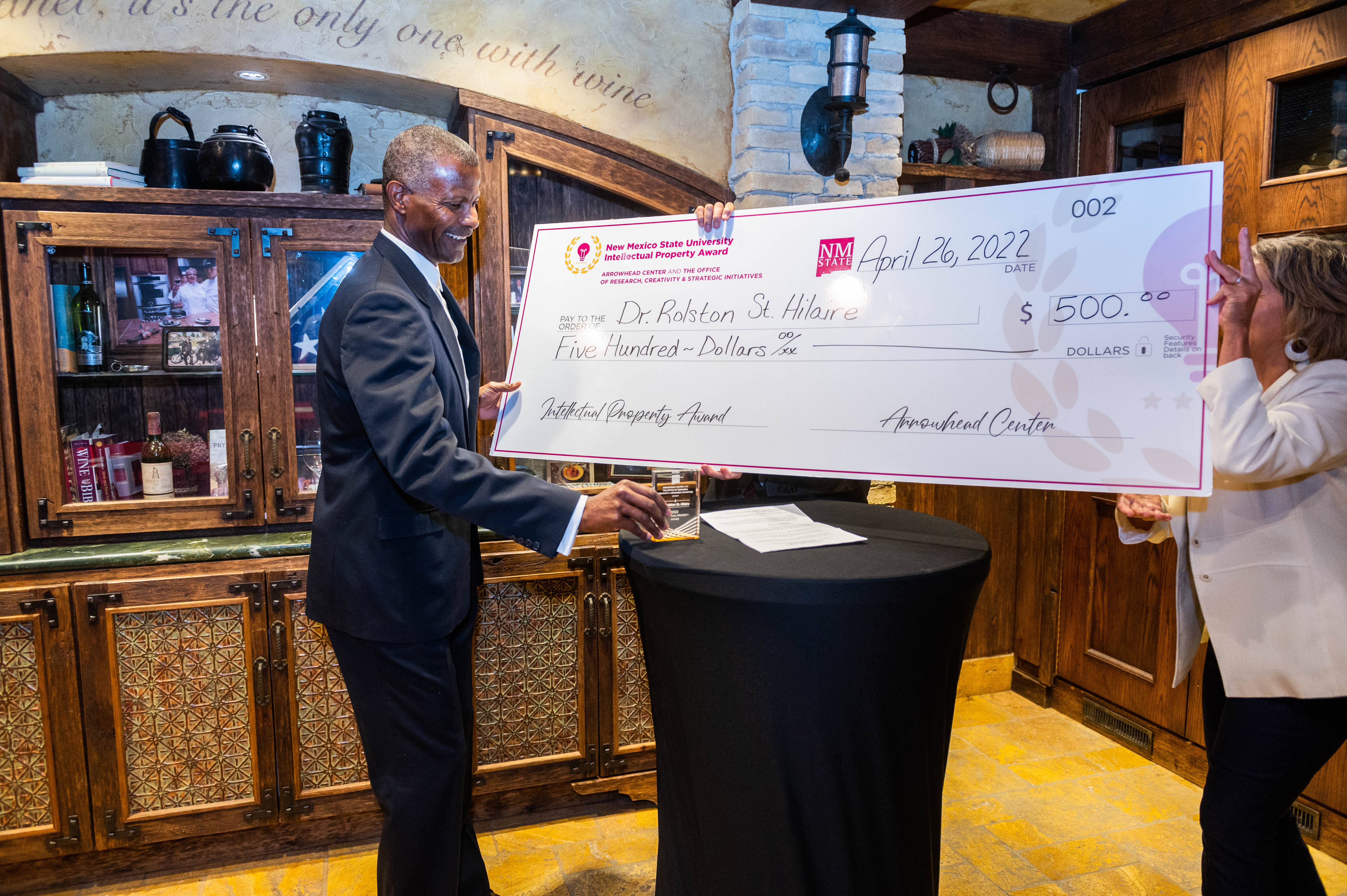 Man holding an oversized check.