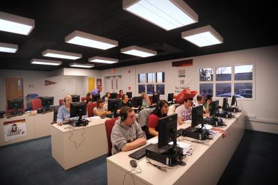 Picture of students sitting at computers in the Aggie Pride Call Center. 