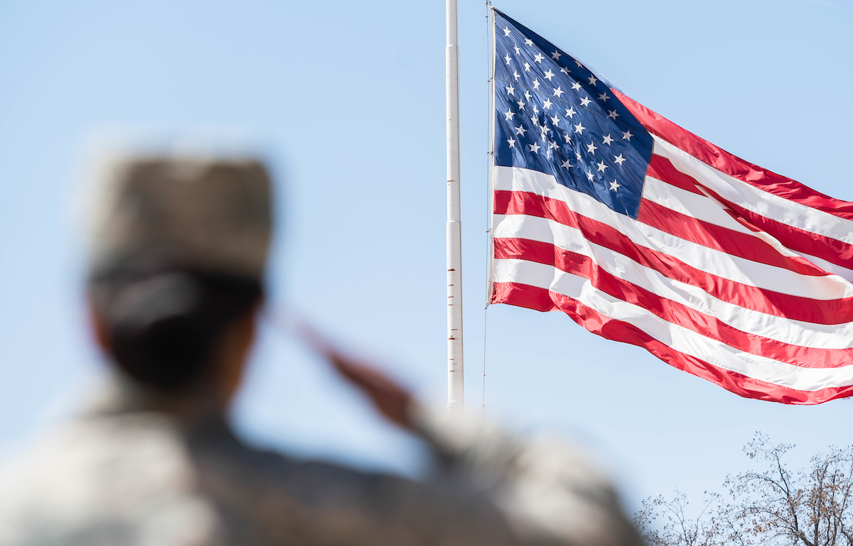 Air Force ROTC cadet salutes the American Flag