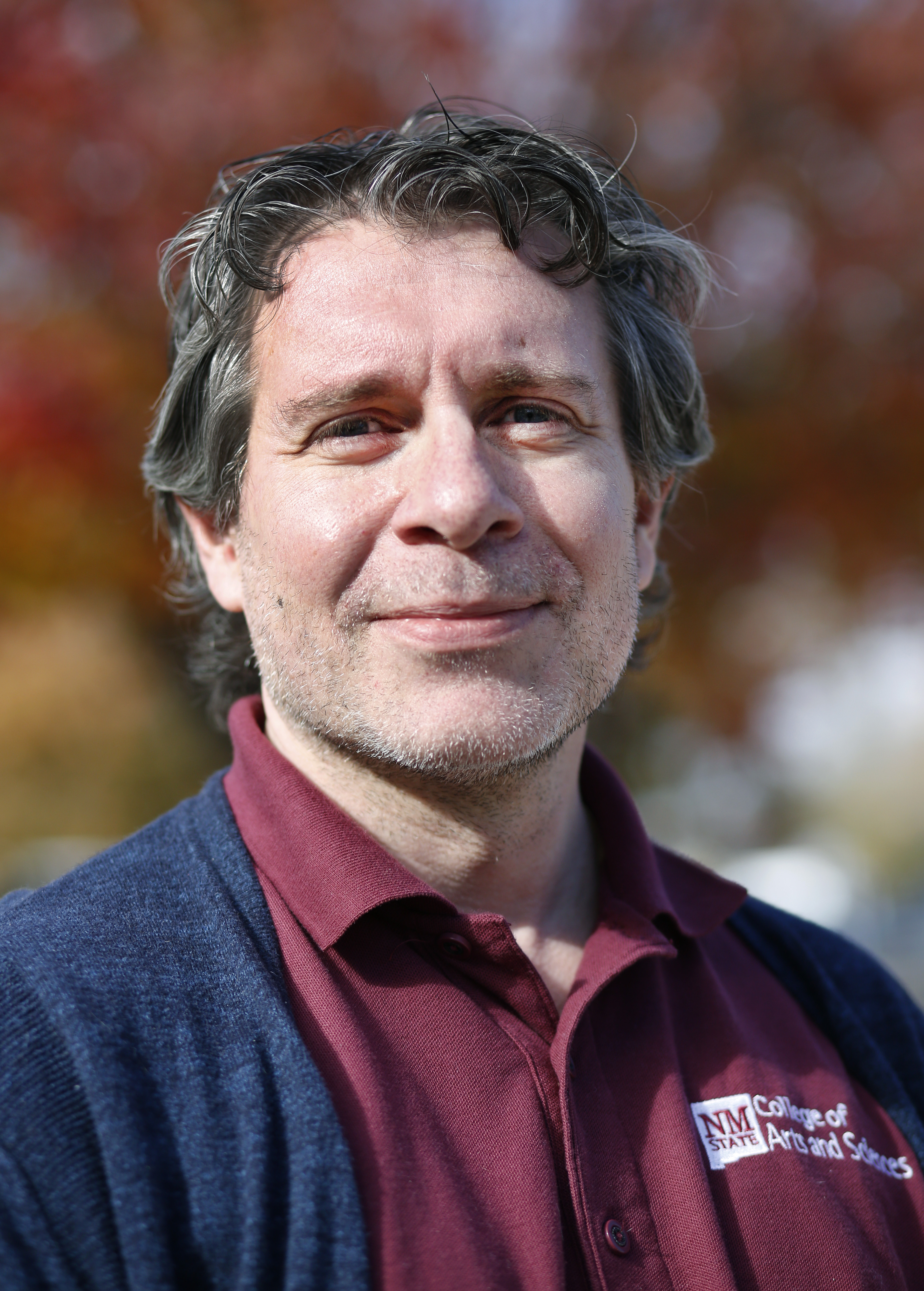 Head and shoulders of a man standing outdoors