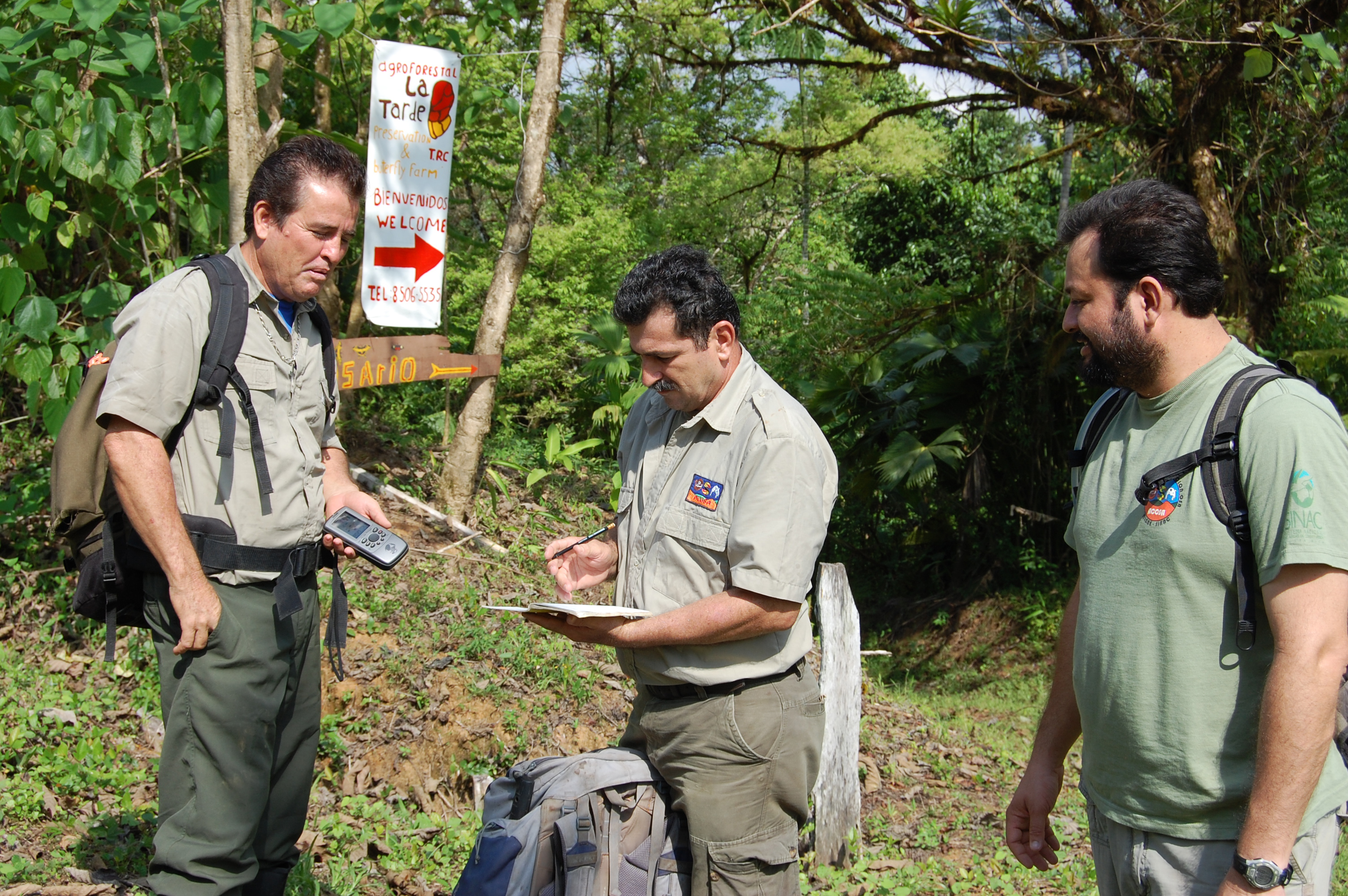 Members of a Costa Rican research team prepare to collect animal population data.