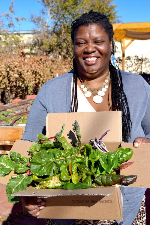 lady with box of greens